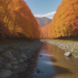 【釣りスポット】紅葉の中を流れる川 | ヤマメとイワナを釣るポイント をイメージした 広角の風景、秋、川 の写真